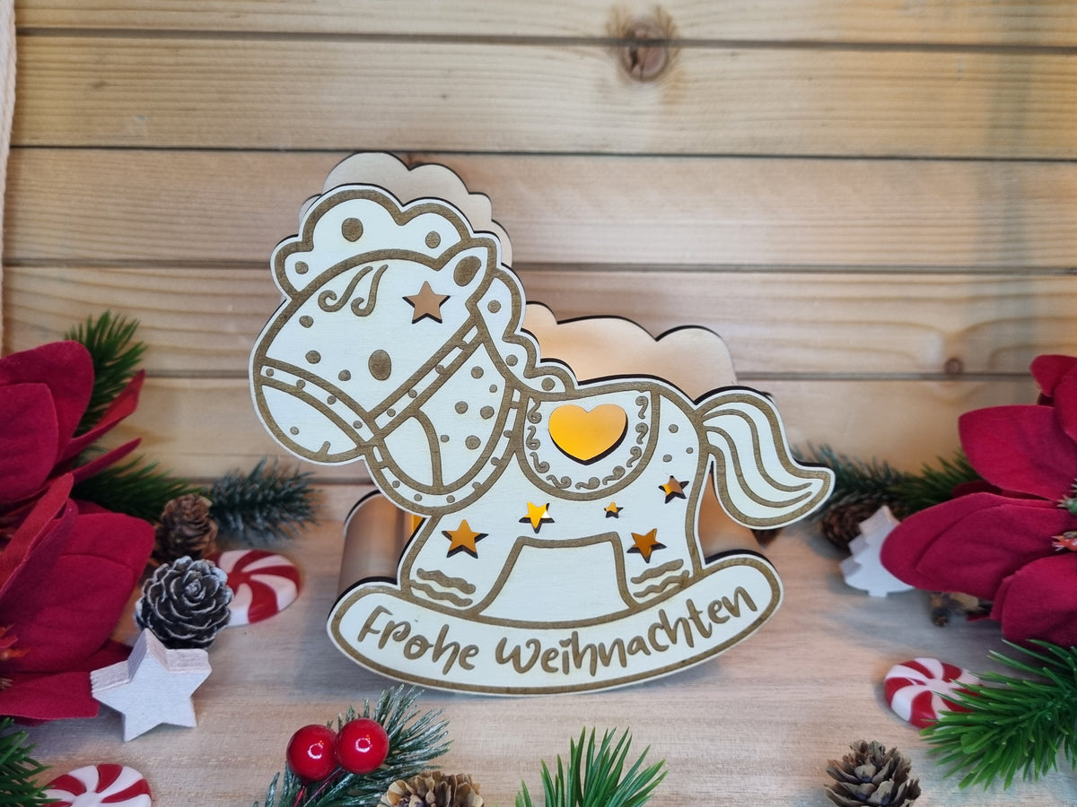 Schaukelpferd Teelicht Frohe Weihnachten aus Holz mit LED-Lichteffekt